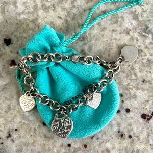 Tiffany Fifth Ave Script bracelet. Charm bracelet with additional charms.